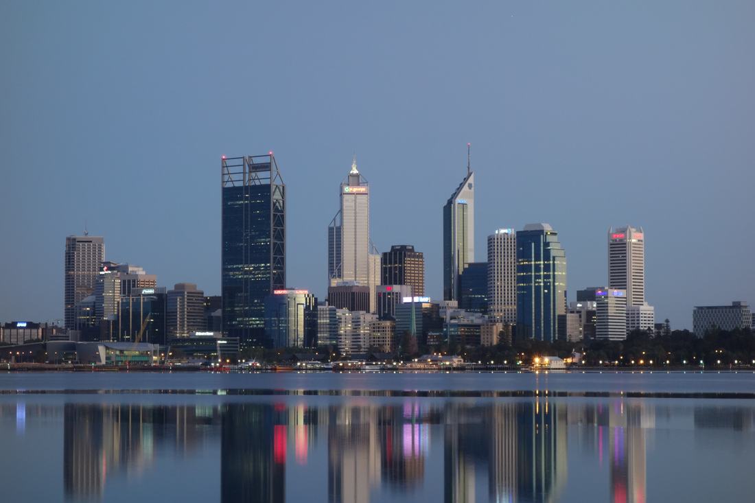 The Perth city skyline across a lake